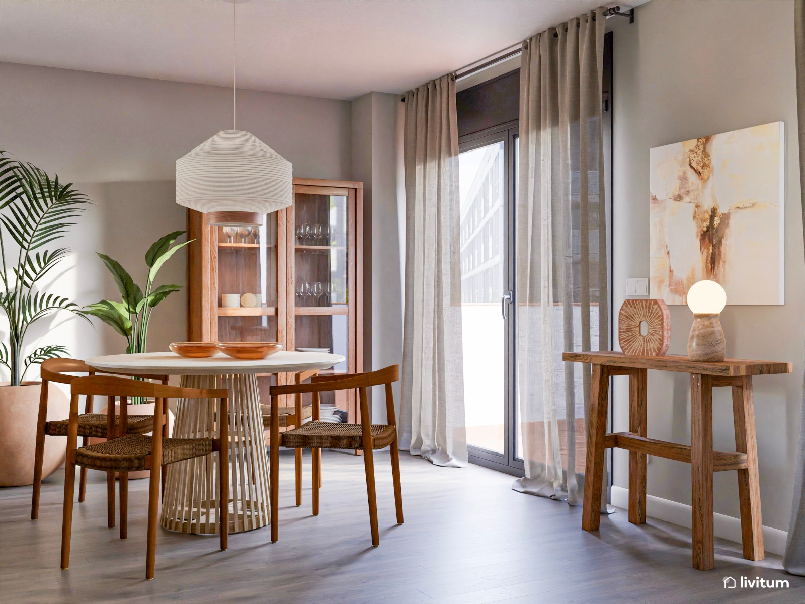 Acogedor salón con comedor redondo, cocina abierta y plantas decorativas