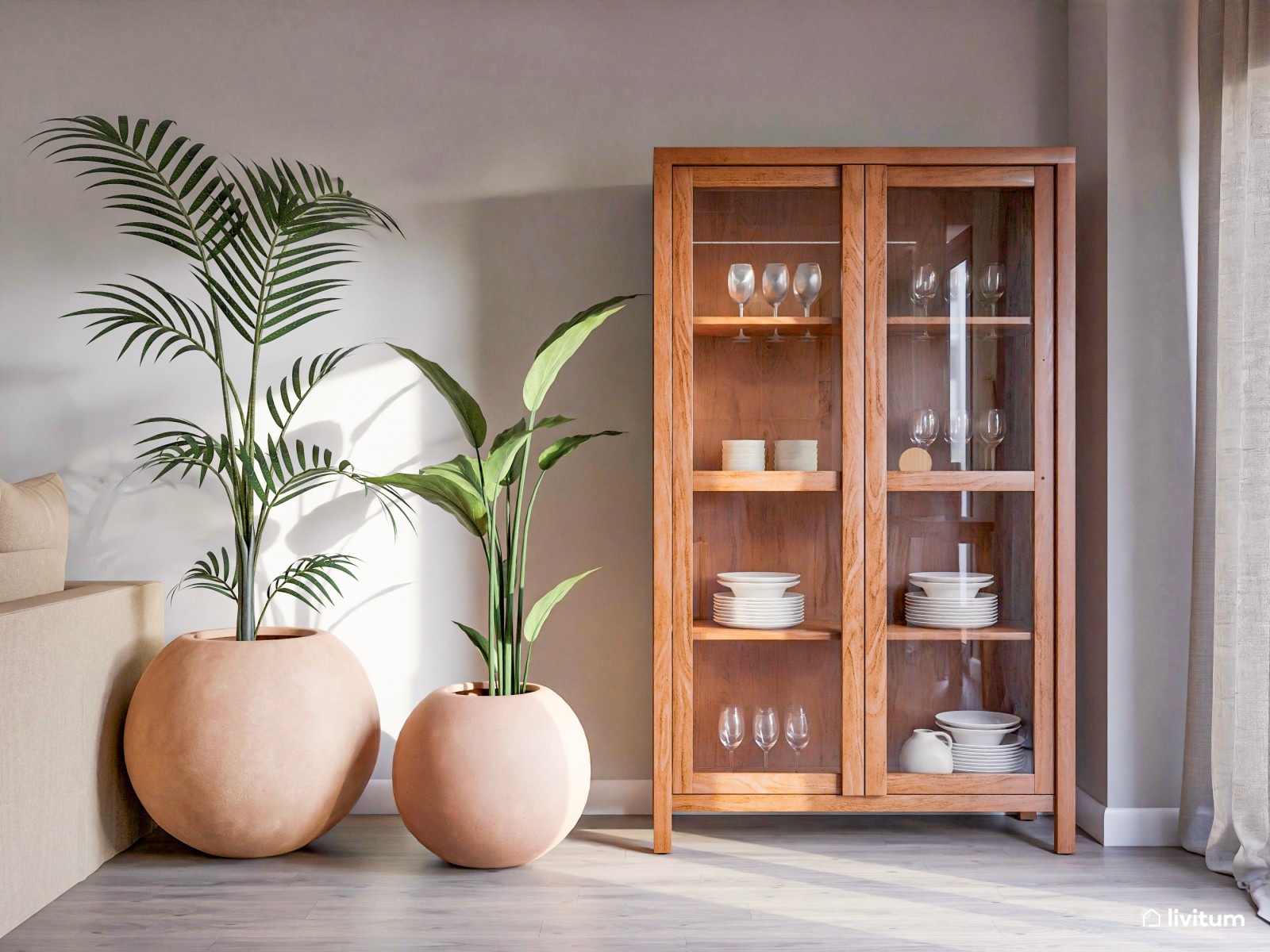 Acogedor salón con comedor redondo, cocina abierta y plantas decorativas