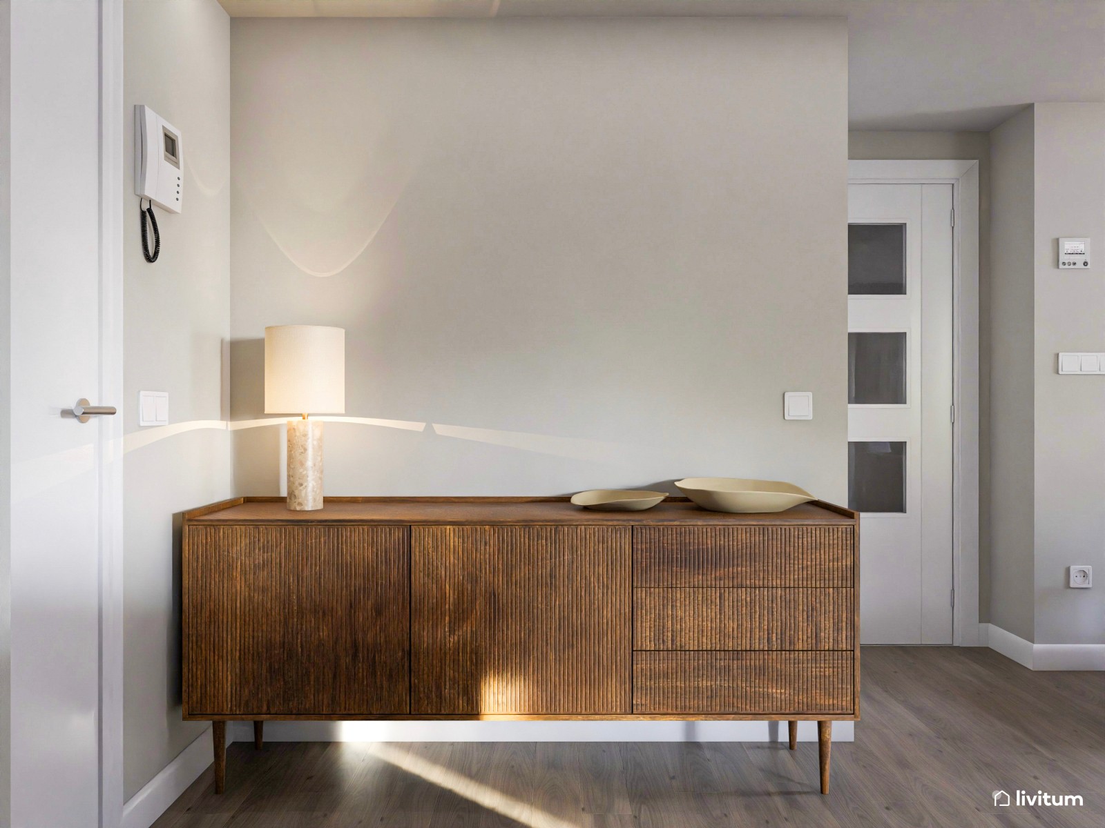 Acogedor salón con comedor redondo, cocina abierta y plantas decorativas