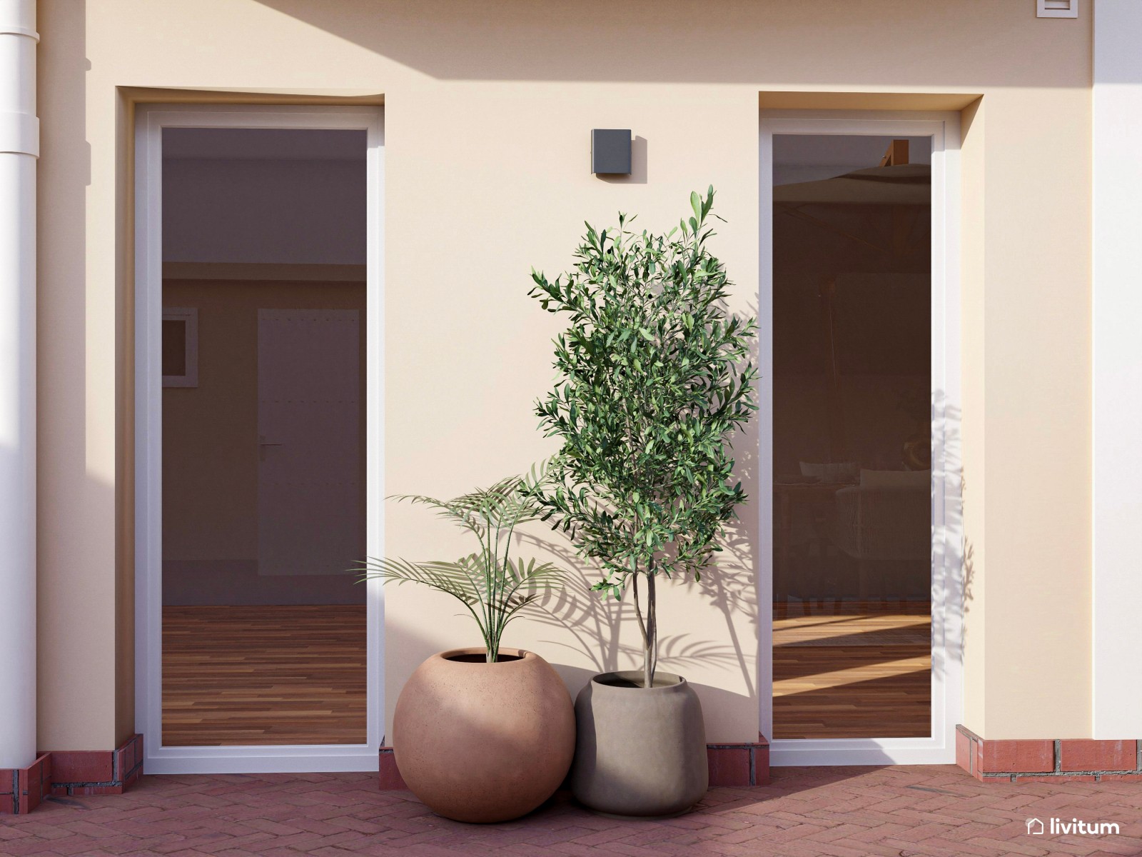 Amplia terraza con zona de relax y comedor repleta de plantas