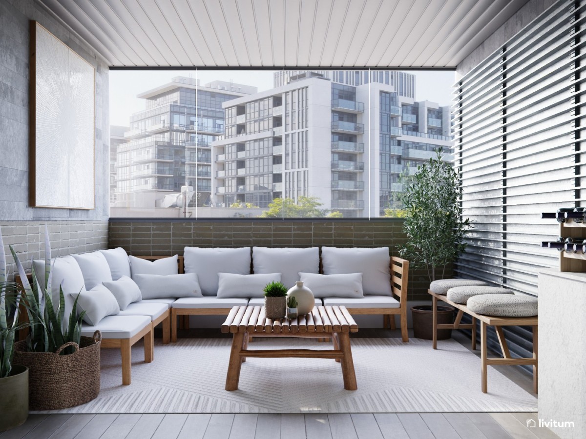 galer&iacute;a en tonos grises, zona de descanso con sof&aacute;s, mesa de centro y plantas decorativas