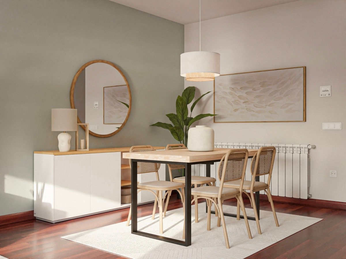 Comedor con mesa en tono madera, cuadro rectangular grande y espejo circular 