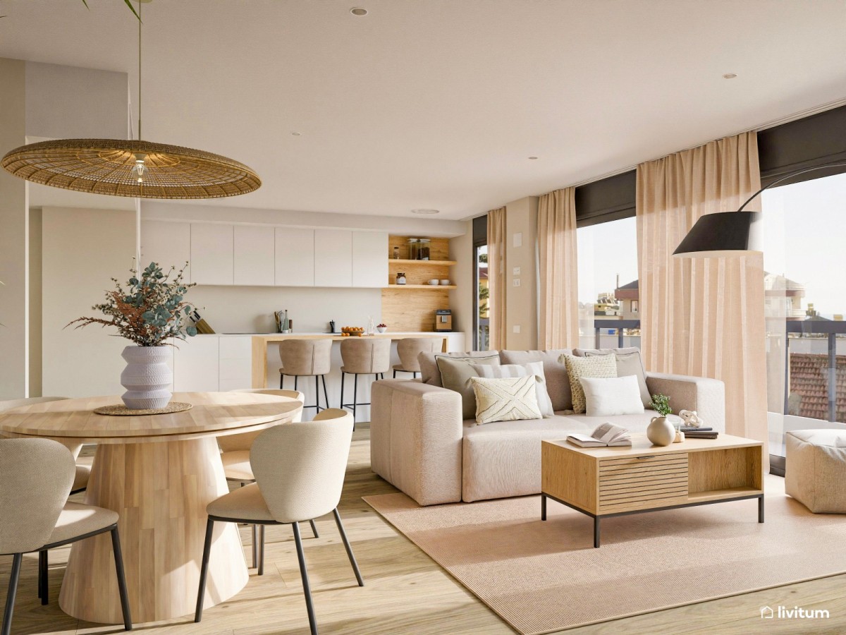 sal&oacute;n comedor con cocina integrada en tonos madera, mesa de comedor circular, sof&aacute; y mesa de centro