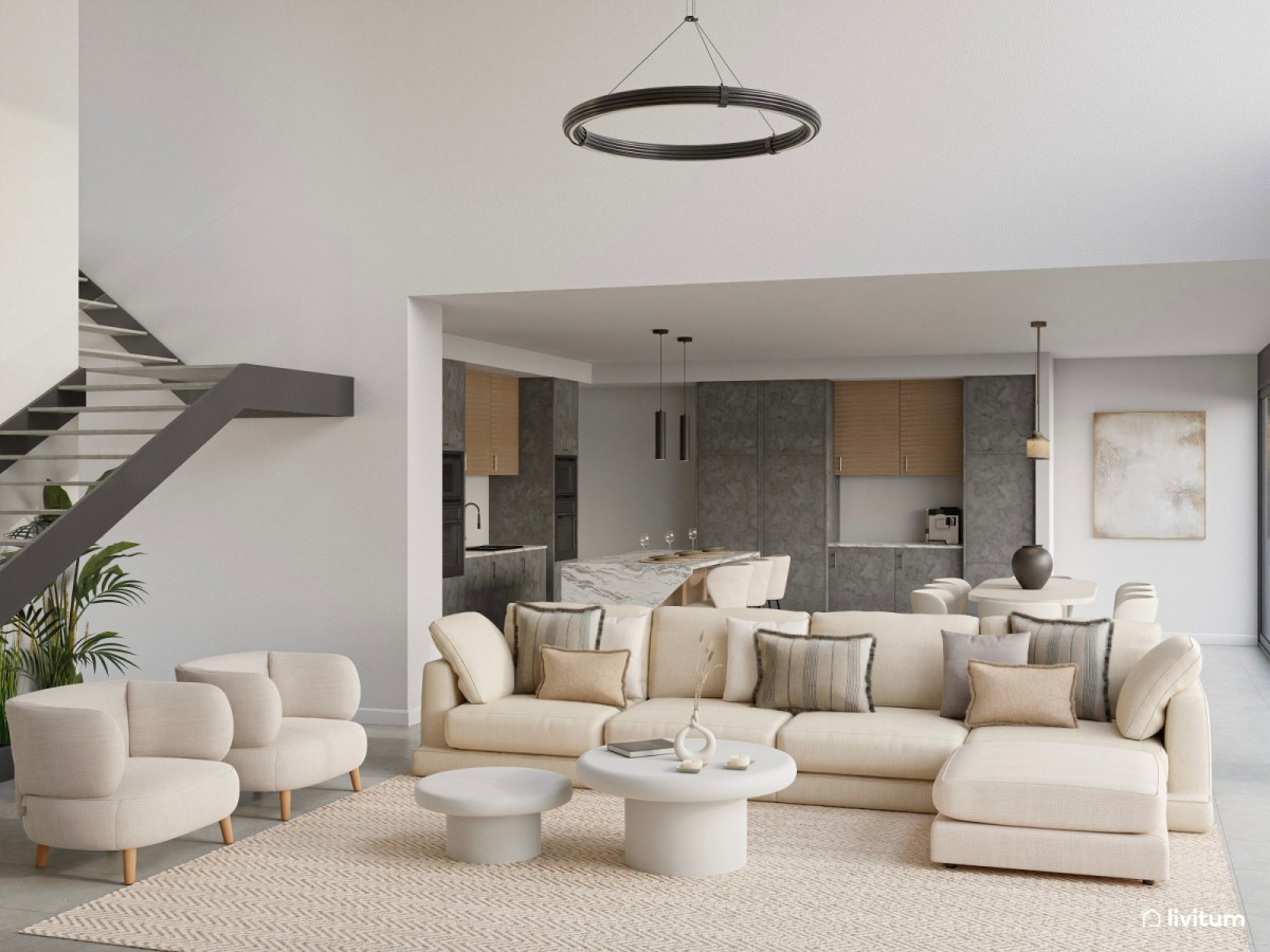 sal&oacute;n comedor con cocina integrada en tonos neutros y oscuros, sof&aacute; grande en L, sillones y mesas de centro