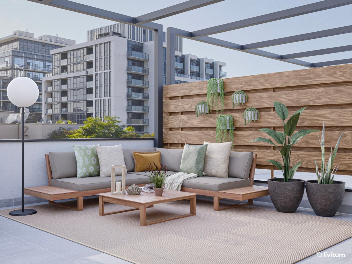 terraza con sof&aacute;s y plantas colgantes y con maceta