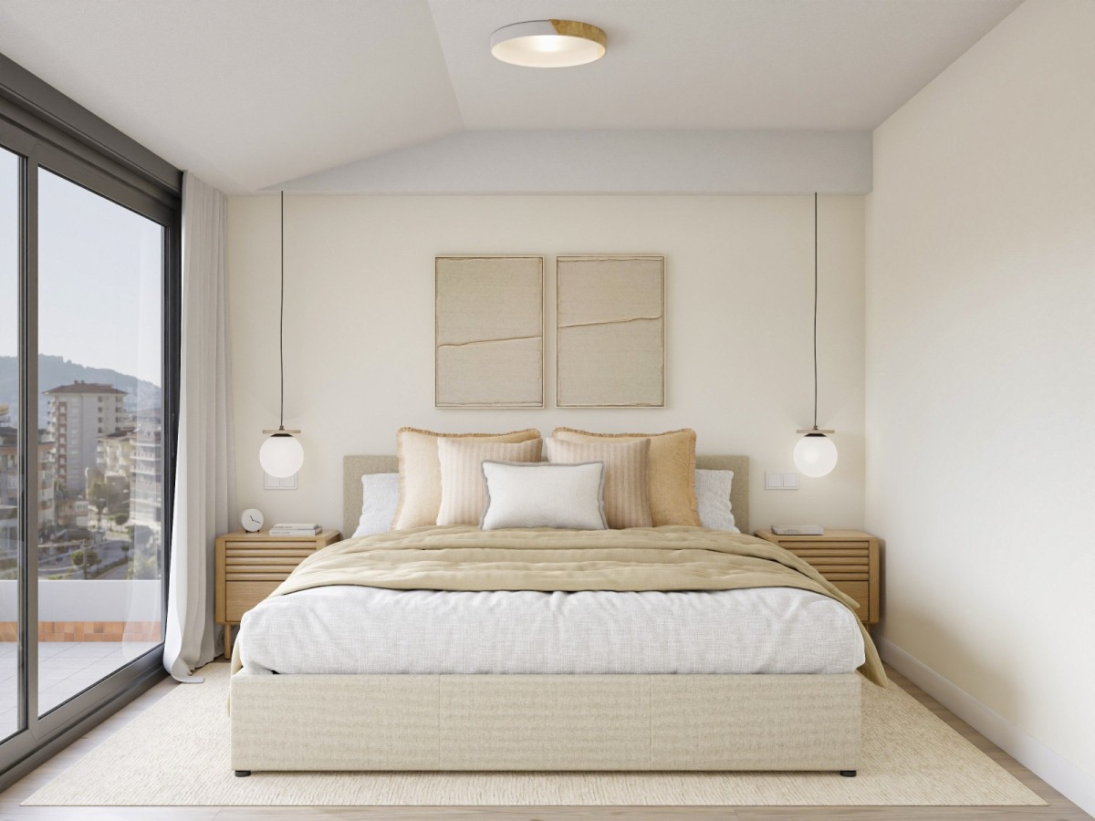 dormitorio en tonos claros, cama de matrimonio y mesas de noche de madera