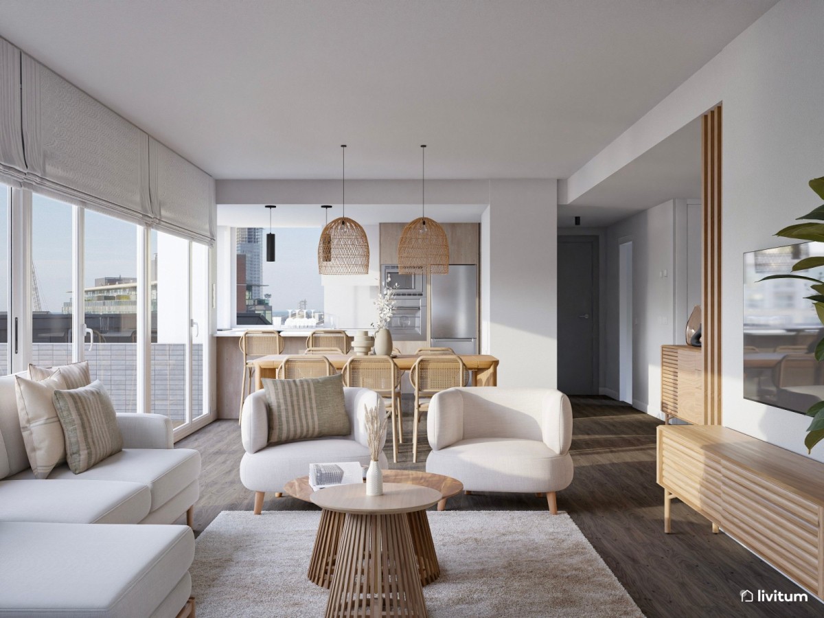 sal&oacute;n comedor con cocina integrada en tonos claros y detalles en madera, sof&aacute; en L, sillones y mesas de centro de madera