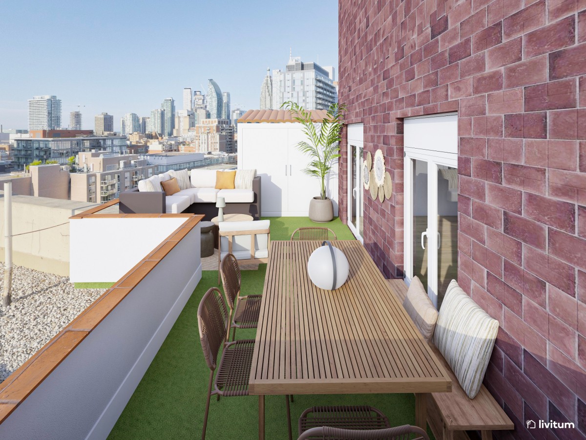 terraza con hierba artificial, mesa de comedor de madera y zona chill out