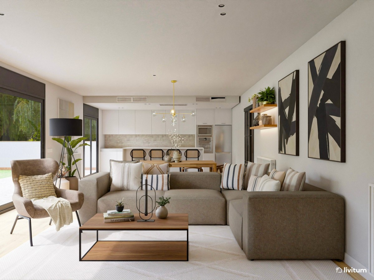 sal&oacute;n comedor con cocina integrada, sof&aacute; en L y grandes cuadros decorativos