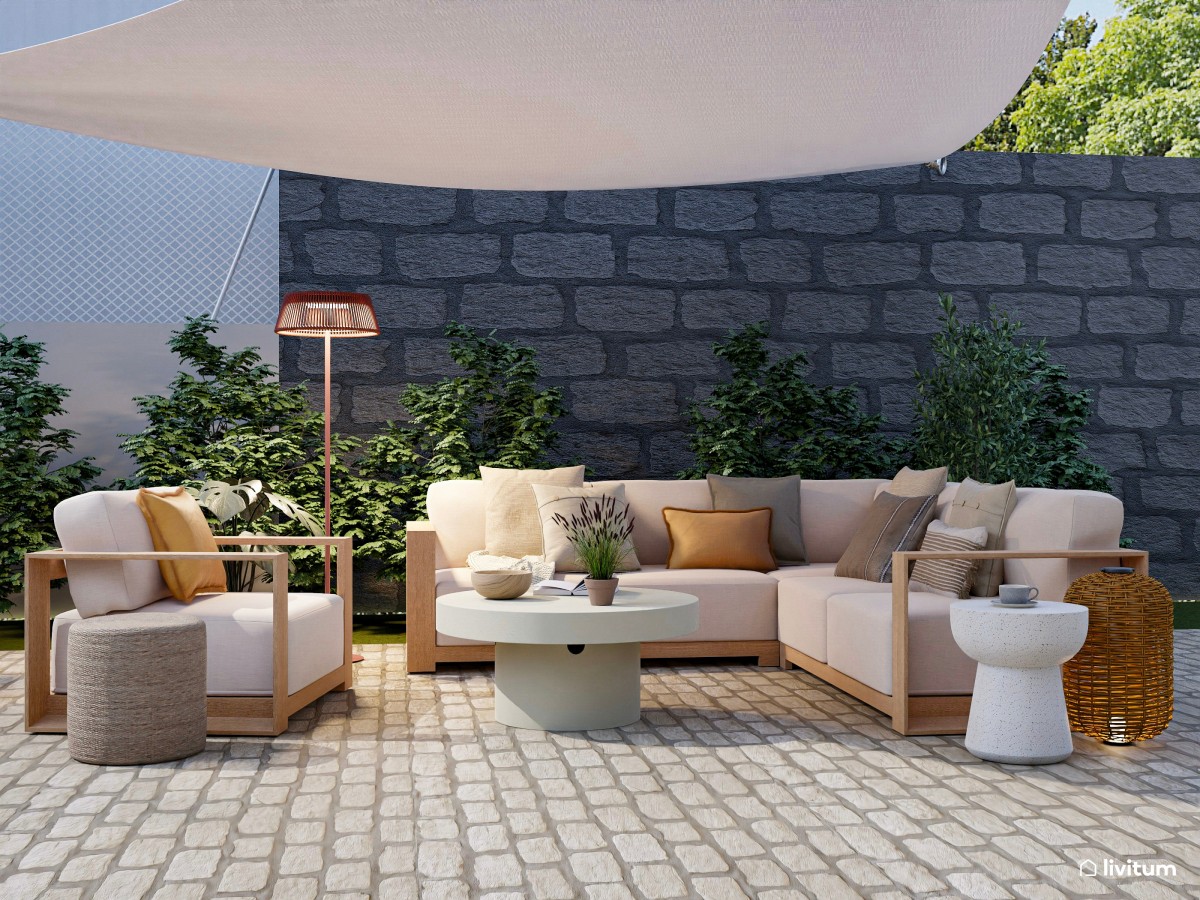 terraza de piedra, sofás en L y sillón y mesa de centro