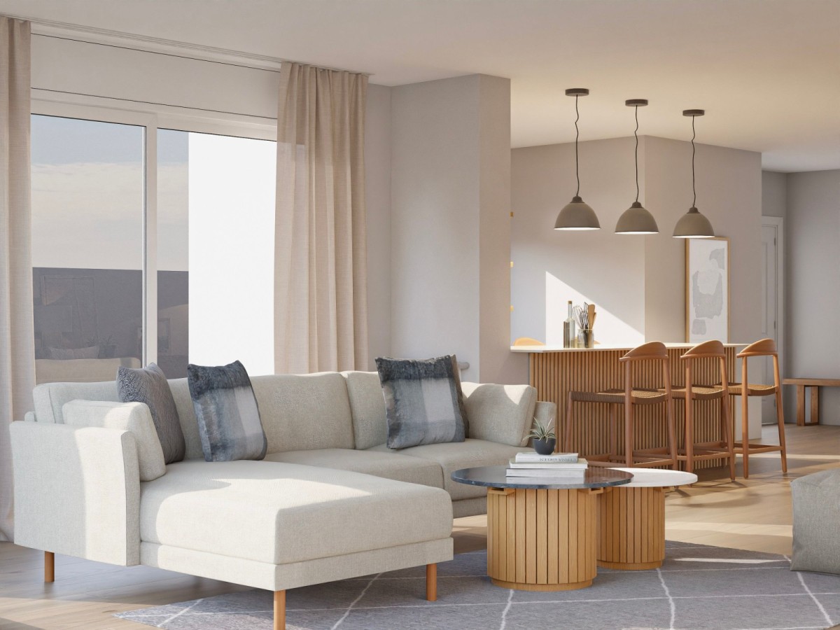 sal&oacute;n con cocina integrada en tonos claros y detalles en madera