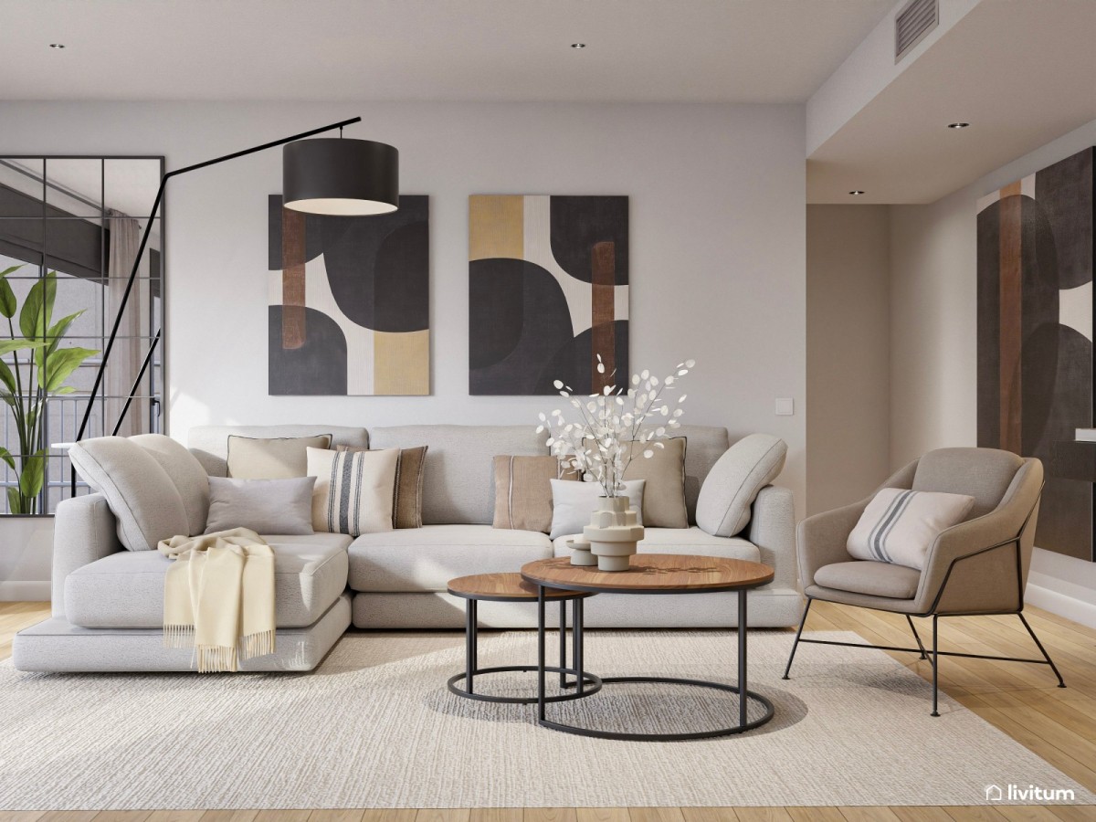 sal&oacute;n en tonos oscuros, sof&aacute; en L y cuadros grandes decorativos