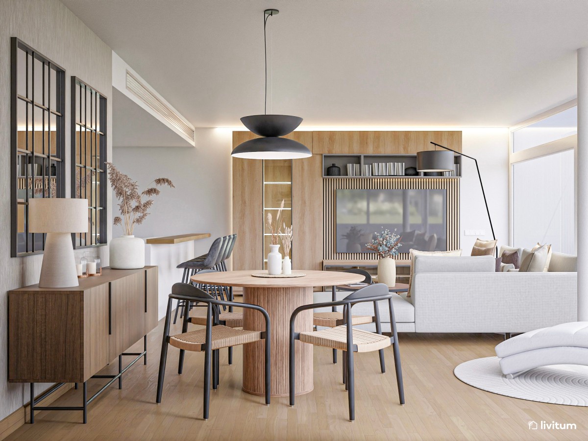 sal&oacute;n comedor con cocina integrada en tonos madera y mesa de comedor redonda