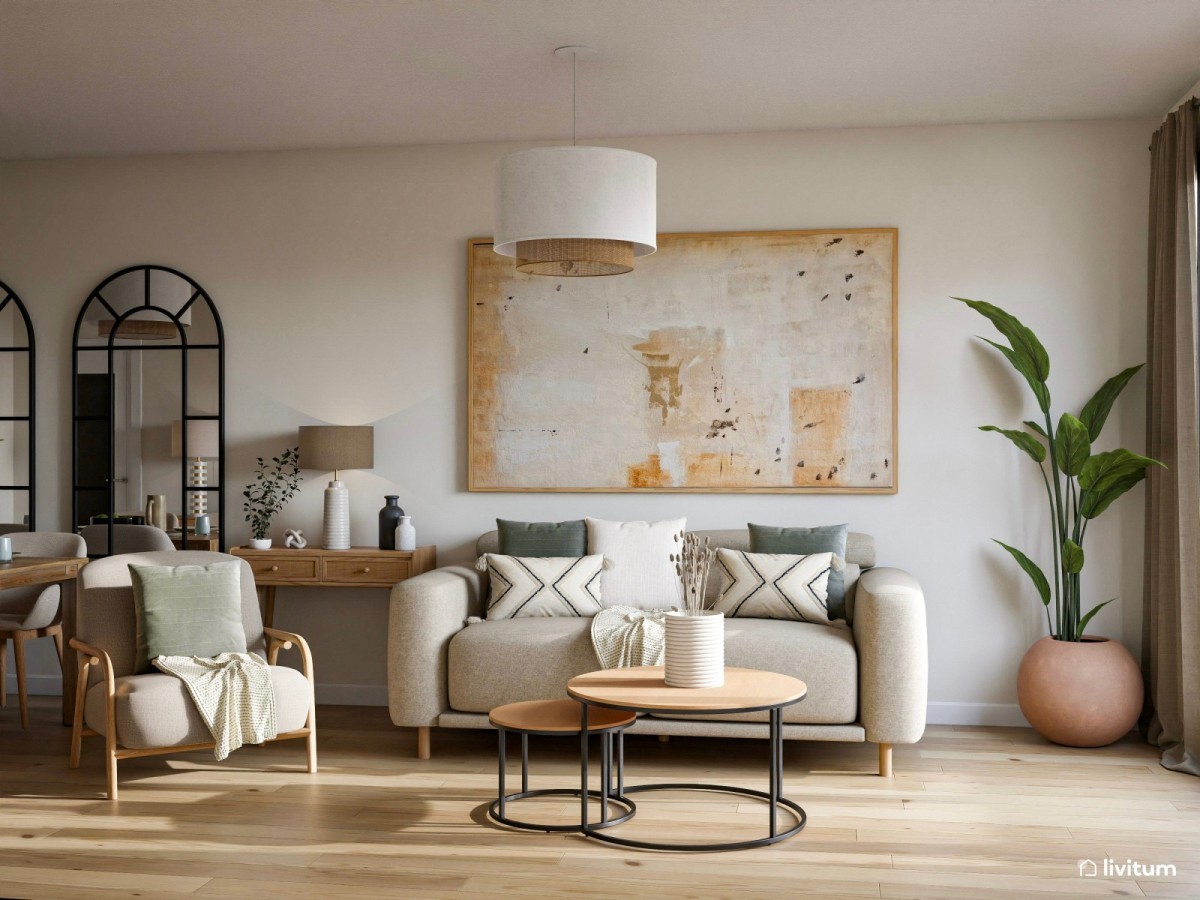 Sal&oacute;n en tonos claros con sof&aacute;, sill&oacute;n y mesa de centro redonda 