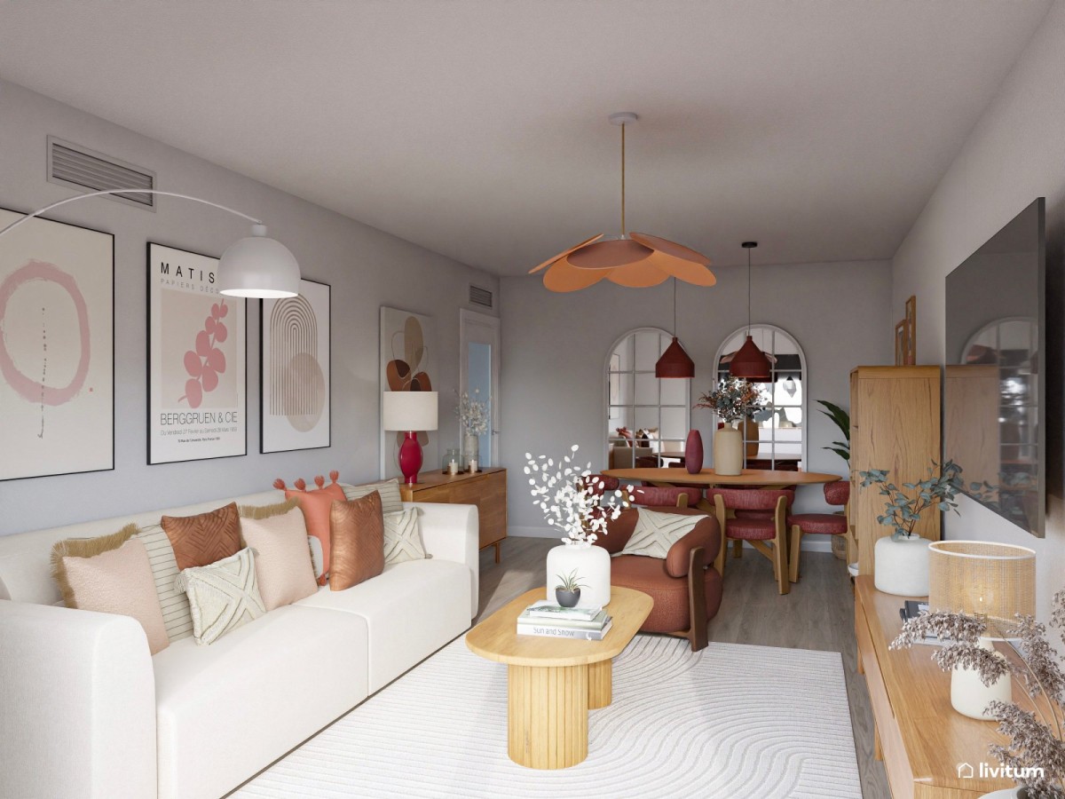 Sal&oacute;n con tonos c&aacute;lidos, sof&aacute; y sill&oacute;n y mesa de comedor ovalada