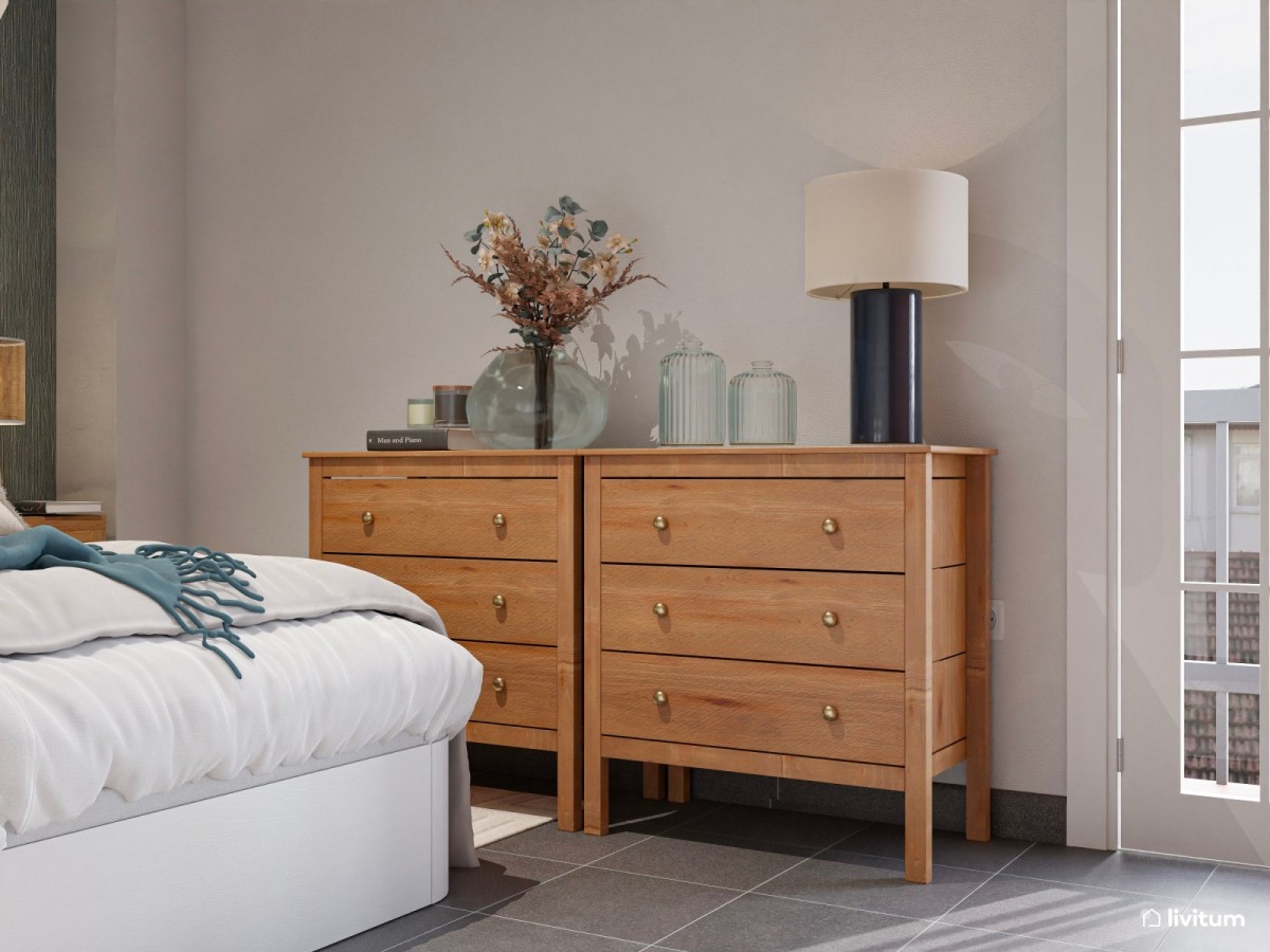 dormitorio con c&oacute;moda de madera y tiradores dorados