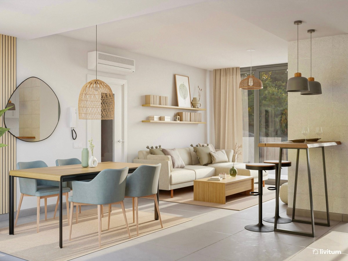 salón comedor con cocina integrada en tonos pastel, sofá en L y mesa de centro