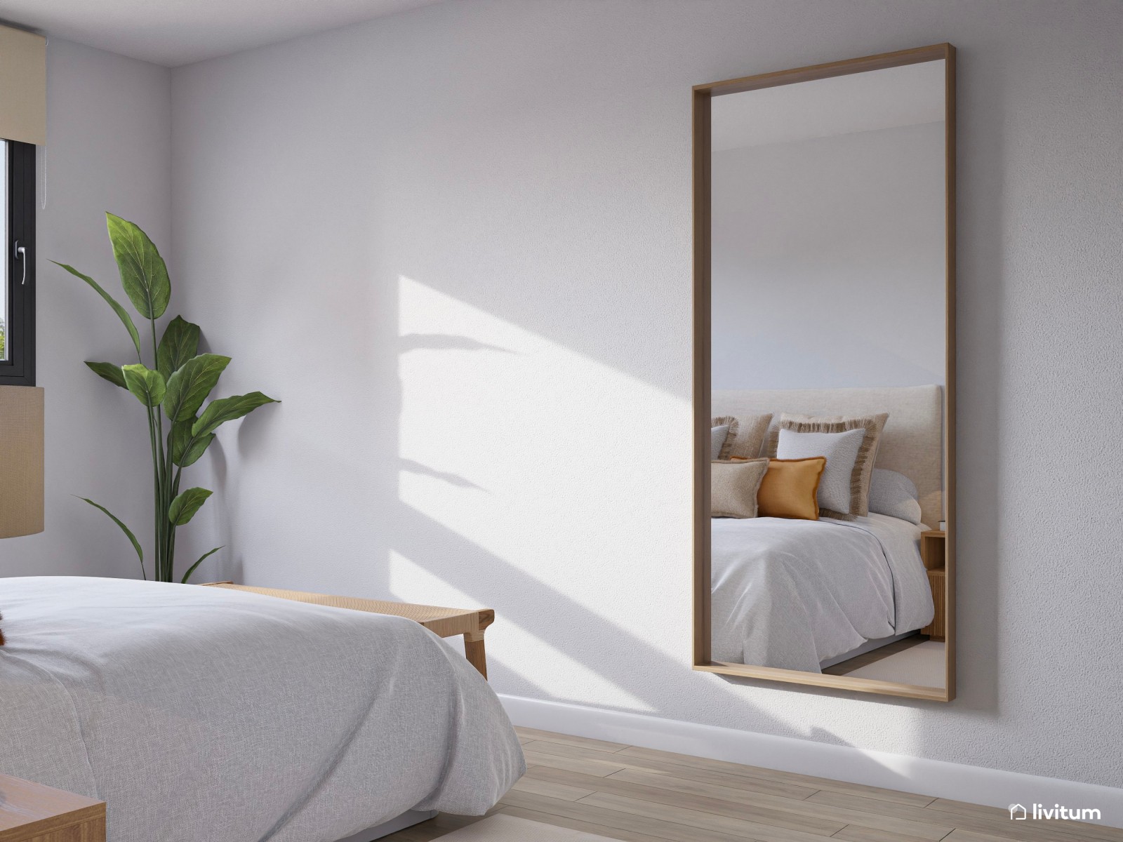 Dormitorio nórdico con pequeñas obras de arte y planta decorativa