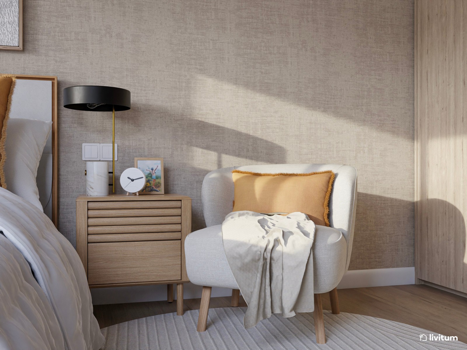 Dormitorio nórdico en tonos arena y butaca de chenilla beige 