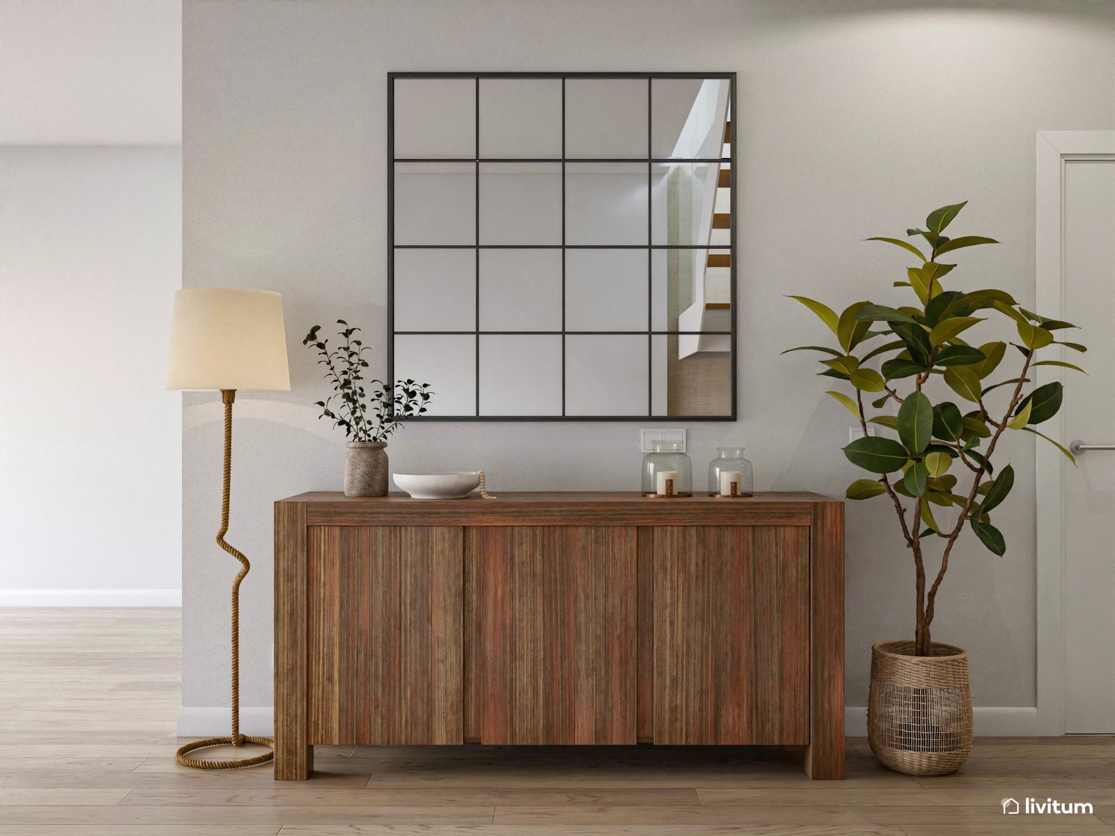 Espacioso recibidor con escalera, con muebles de madera oscura