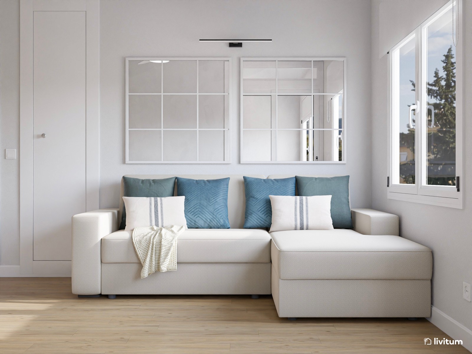 Estudio moderno en tonos claros con sofá cama y zona de trabajo