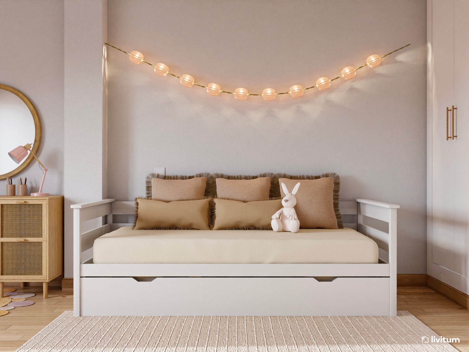 Habitación infantil en tonos pastel con cama nido y escritorio