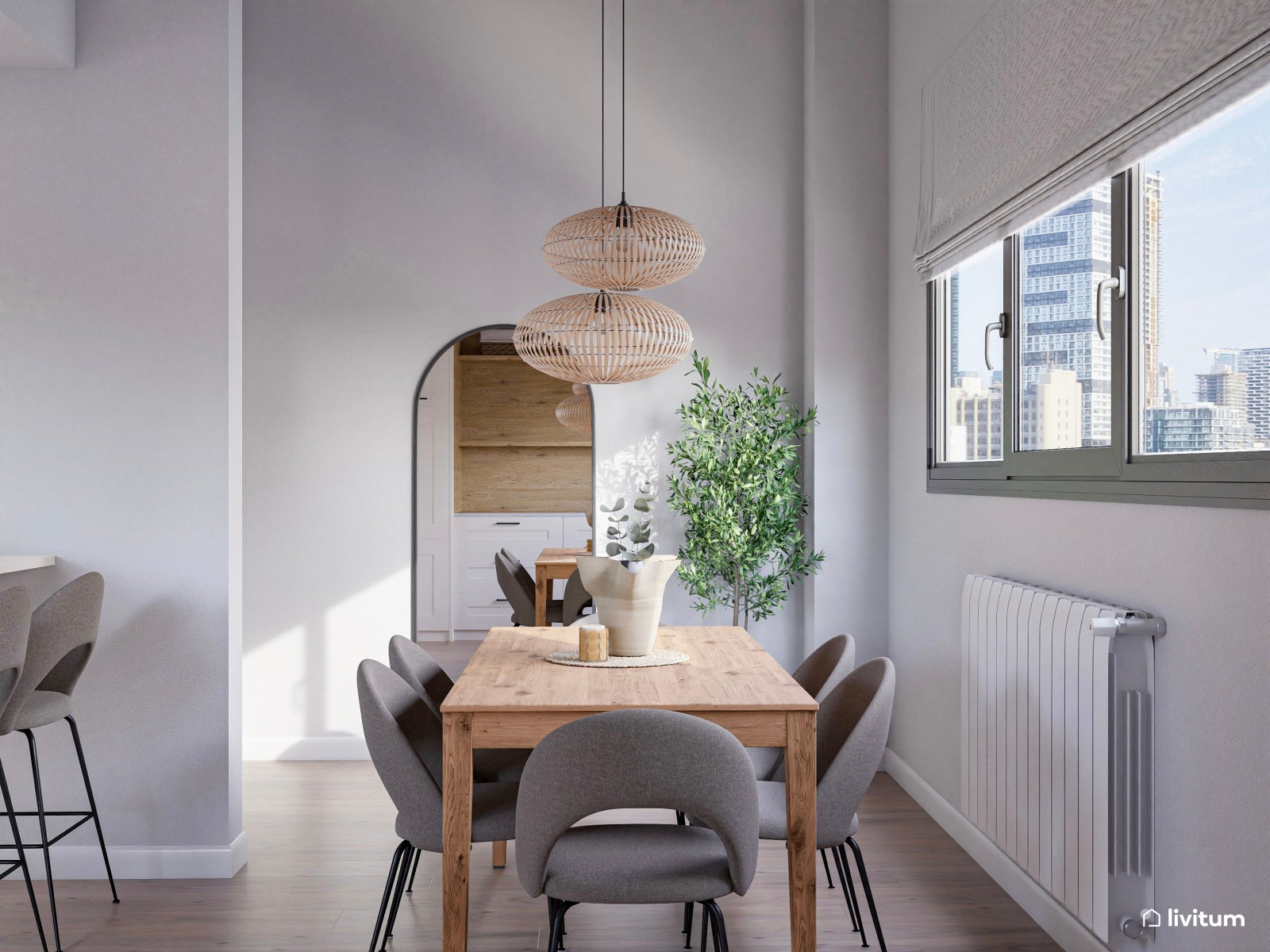 Salón comedor con cocina abierta con divertida pared repleta de cuadros