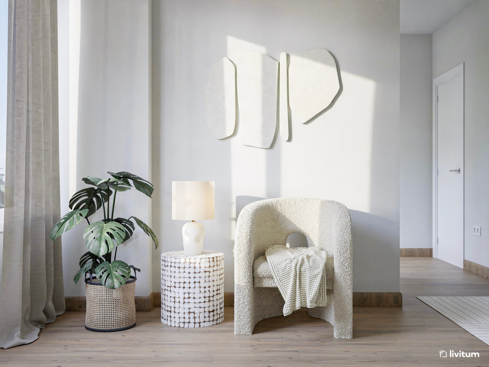 Salón comedor con cocina abierta de tonos claros y detalles en madera