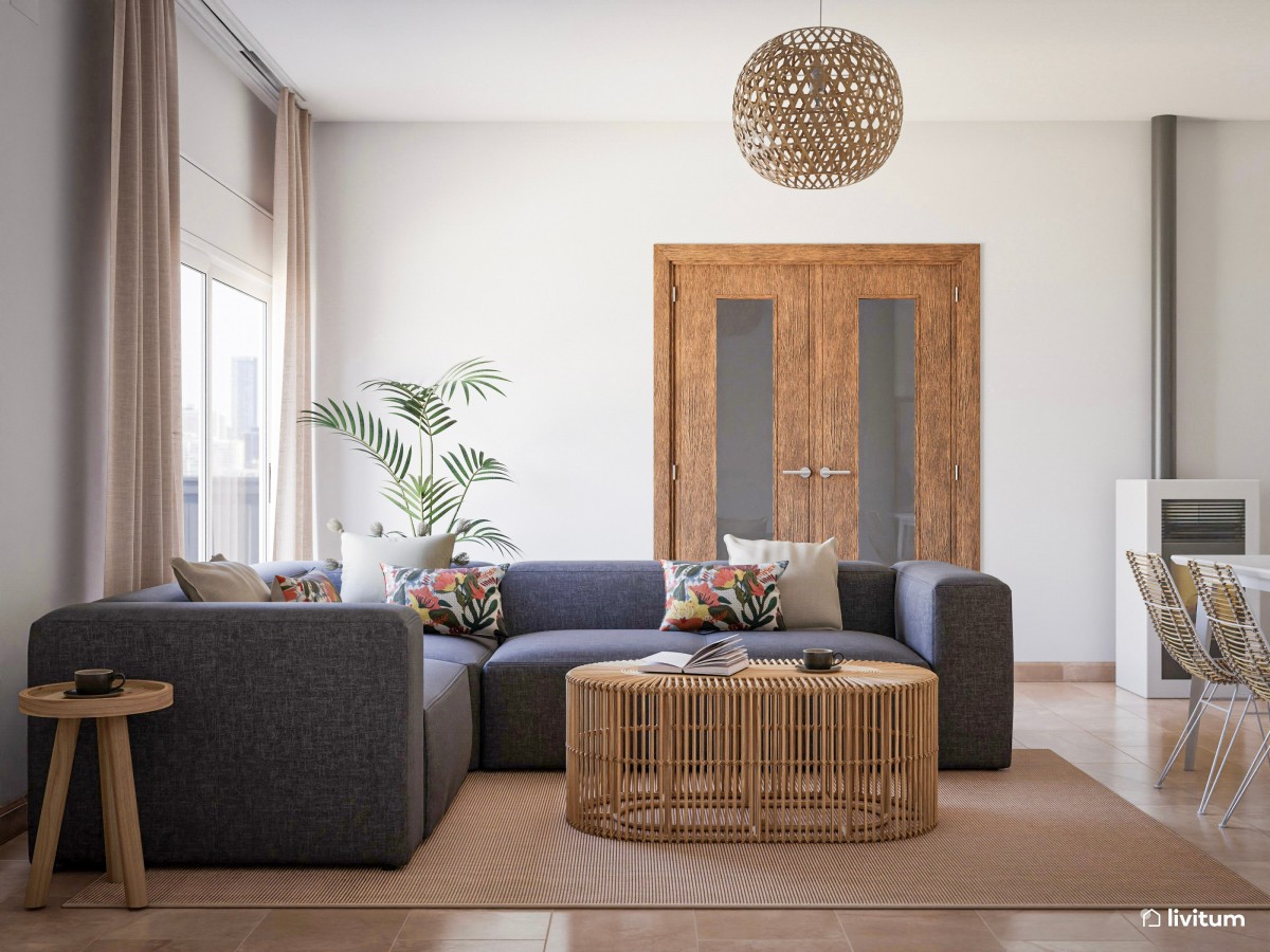 Salón comedor con sofá gris y muebles de ratán