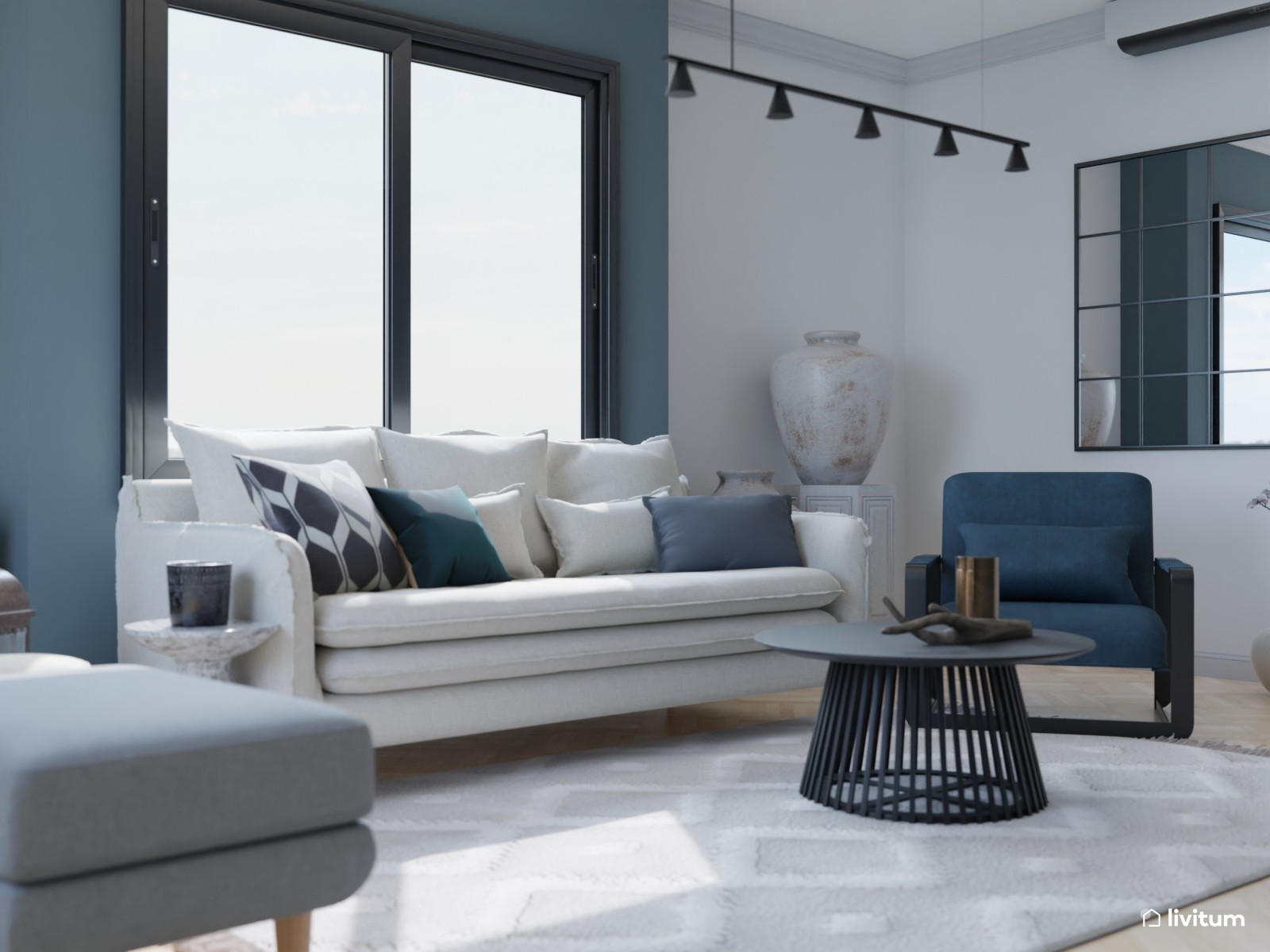 Salón moderno blanco y azul con mucho arte 