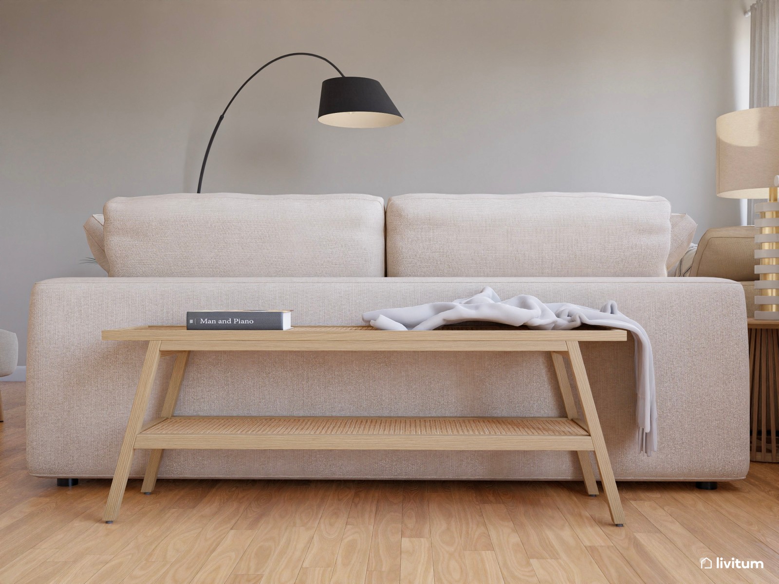 Salón moderno en tonos claros y detalles en negro con rincón de lectura