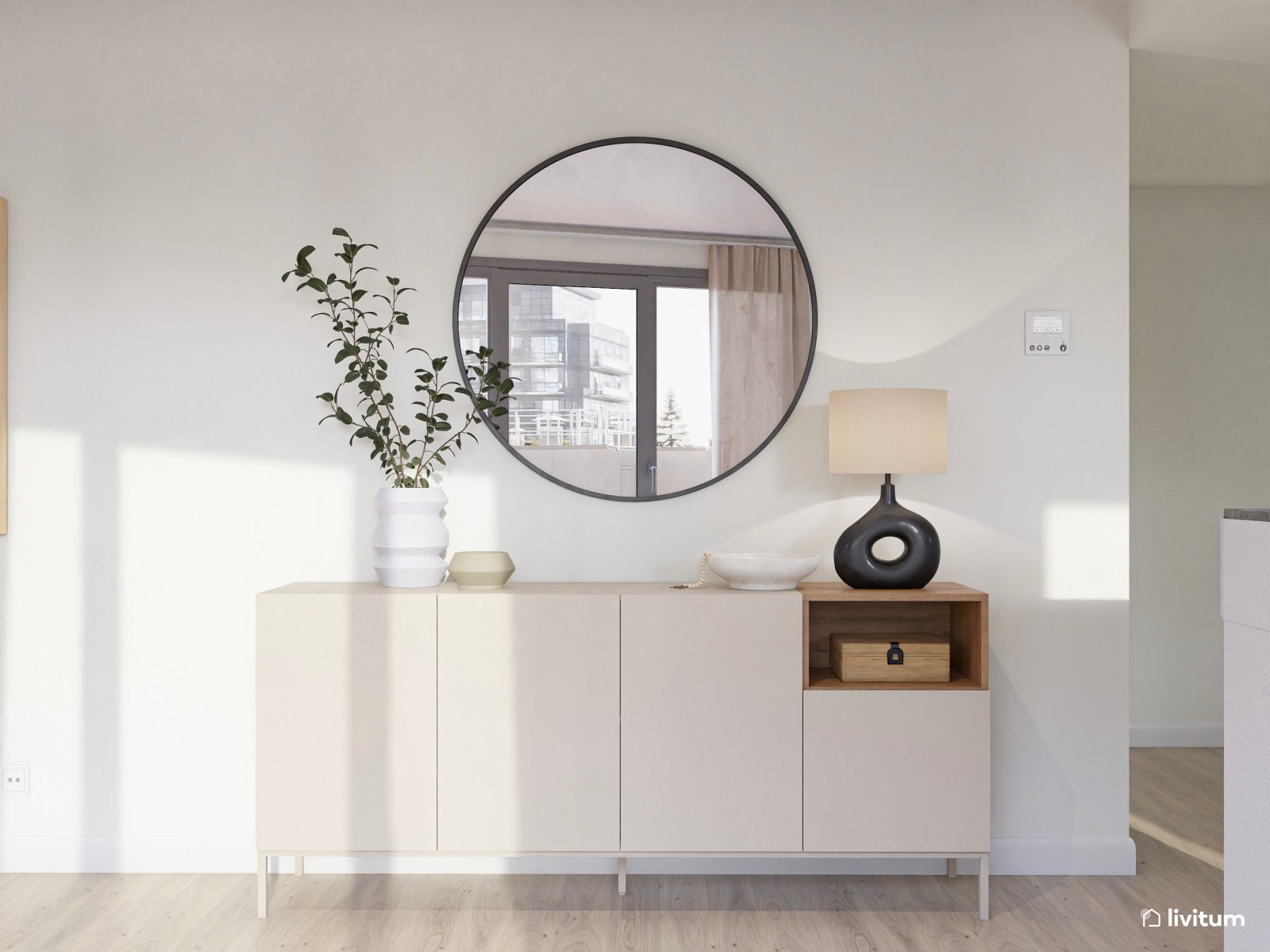 Salón moderno y abierto con mobiliario claro y tapizados elegantes