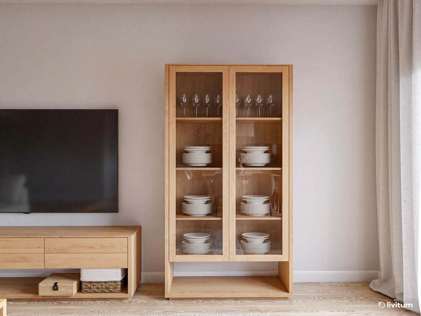 Salón neutro con elegante cocina abierta en negro y verde 