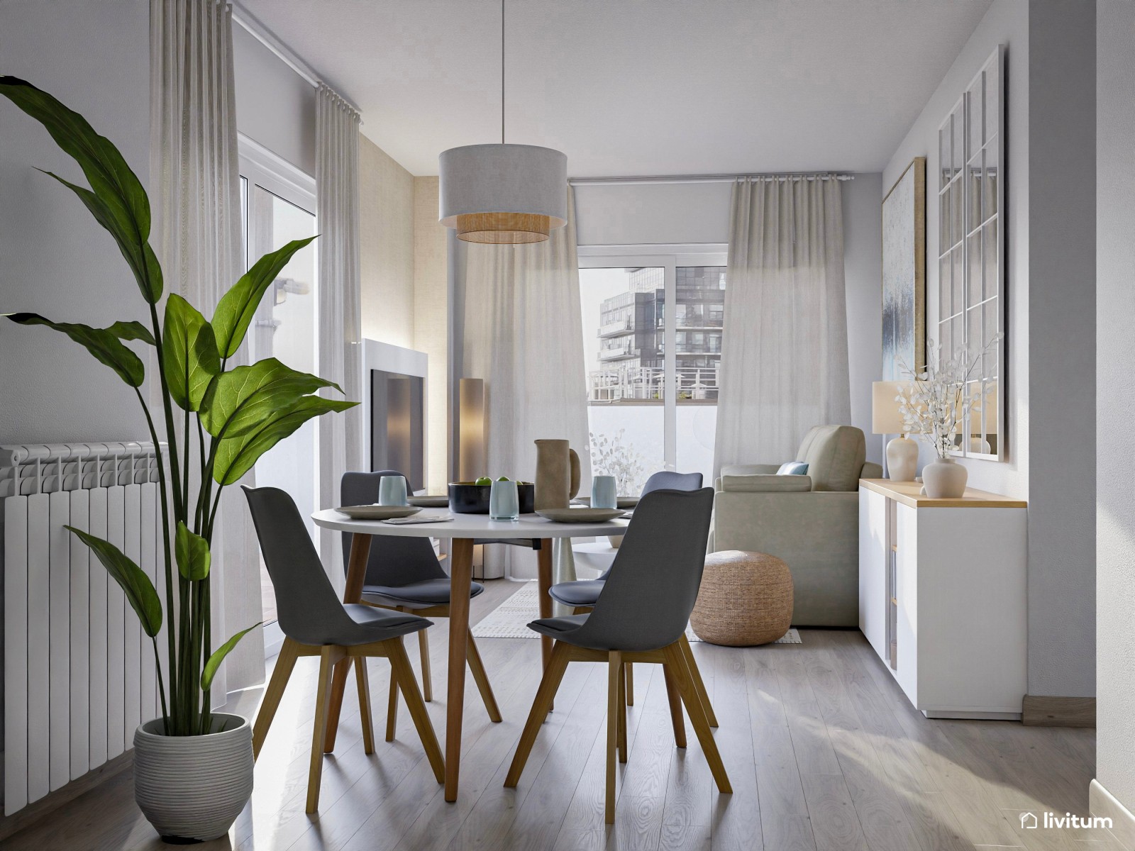 Salón pequeño y moderno con mesa redonda y grandes cuadros decorativos