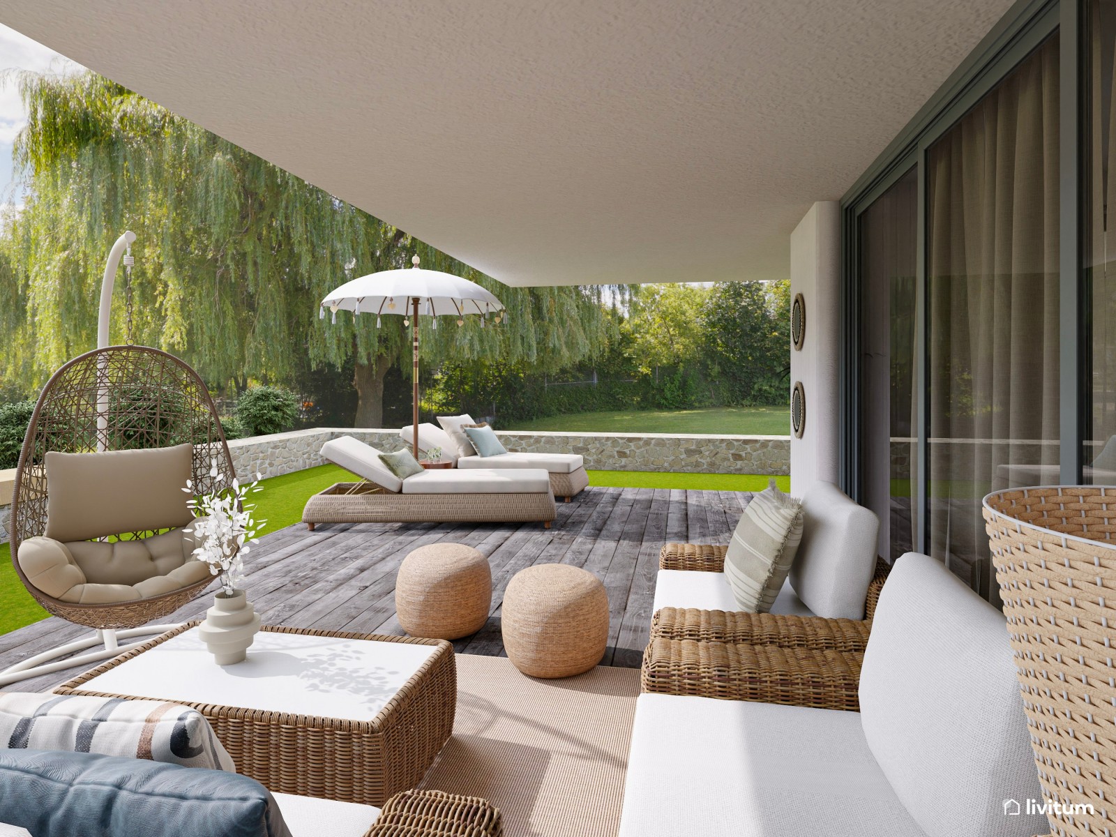 Terraza bohemia con muebles de ratán y cómodas tumbonas 