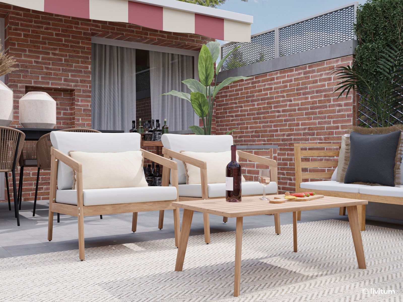 Terraza con amplia zona de sofás, comedor y barbacoa