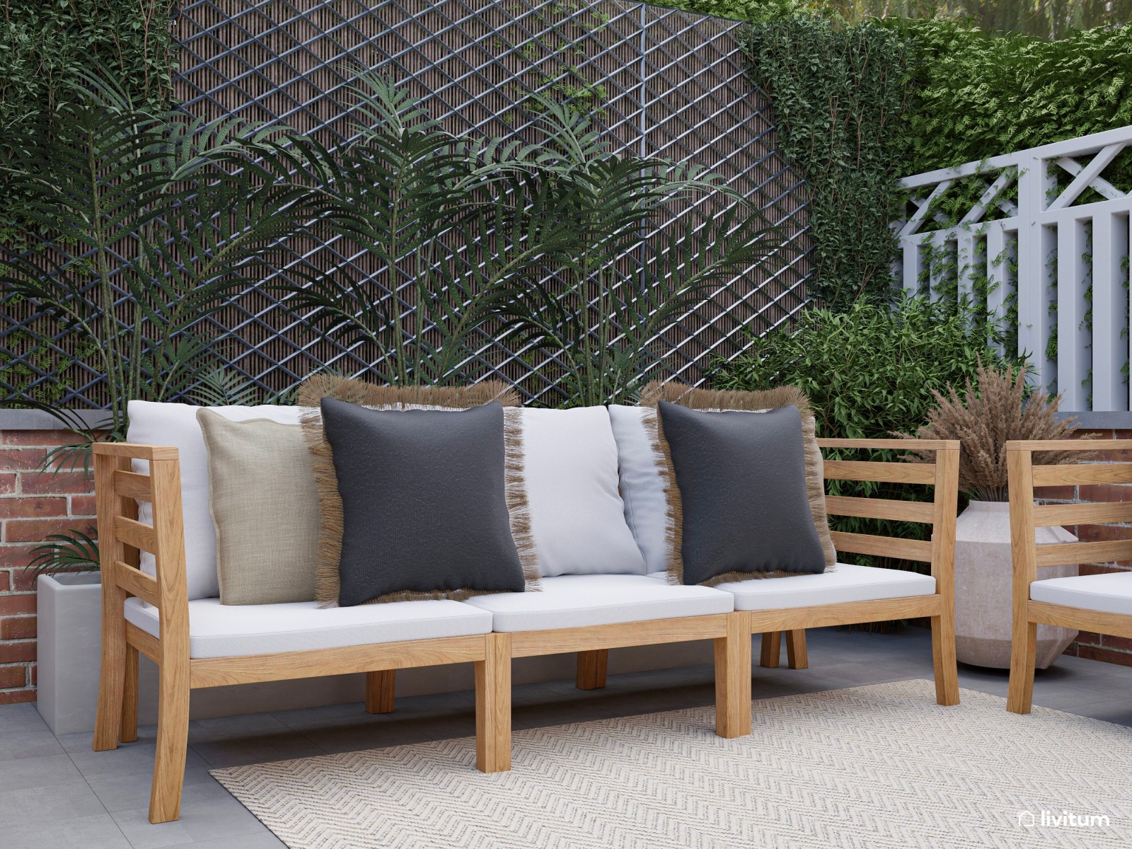 Terraza con amplia zona de sofás, comedor y barbacoa