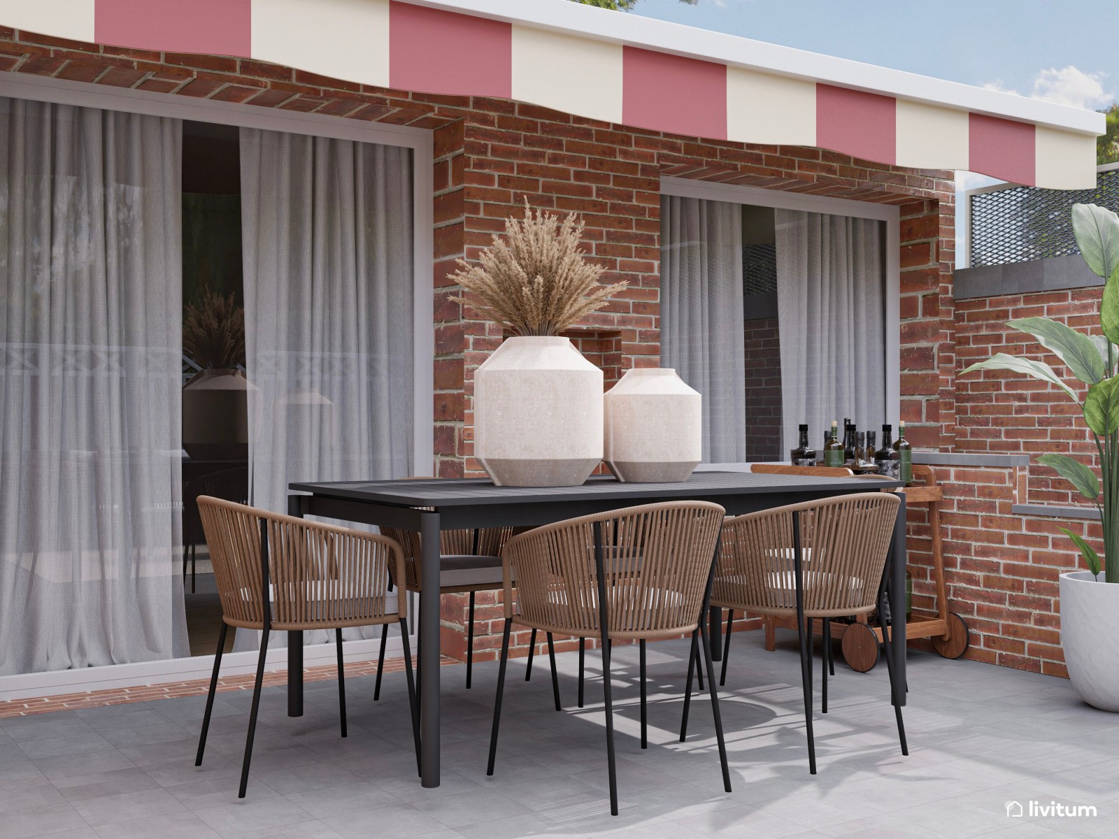 Terraza con amplia zona de sofás, comedor y barbacoa