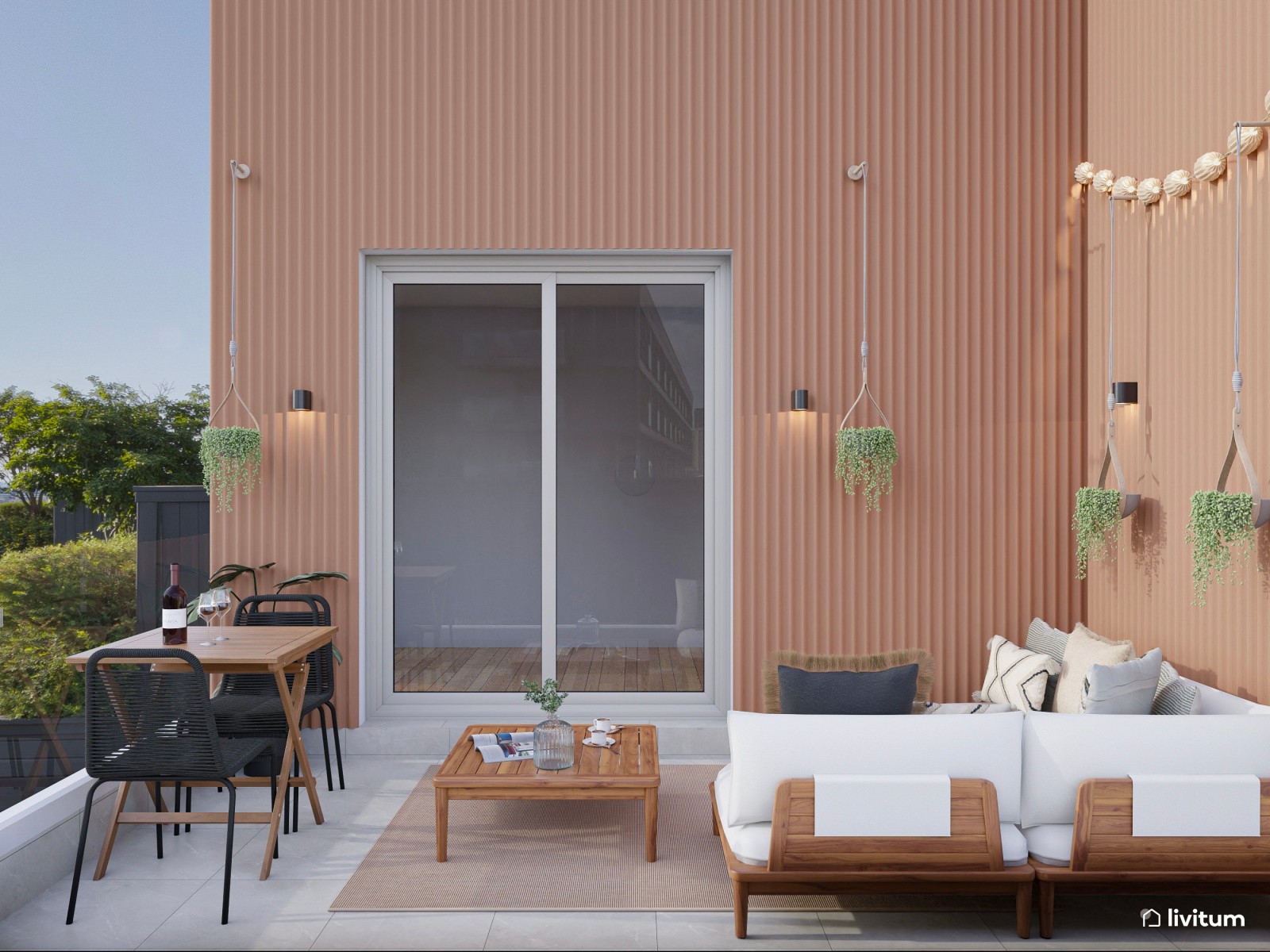 Terraza con zona de descanso y pequeño comedor