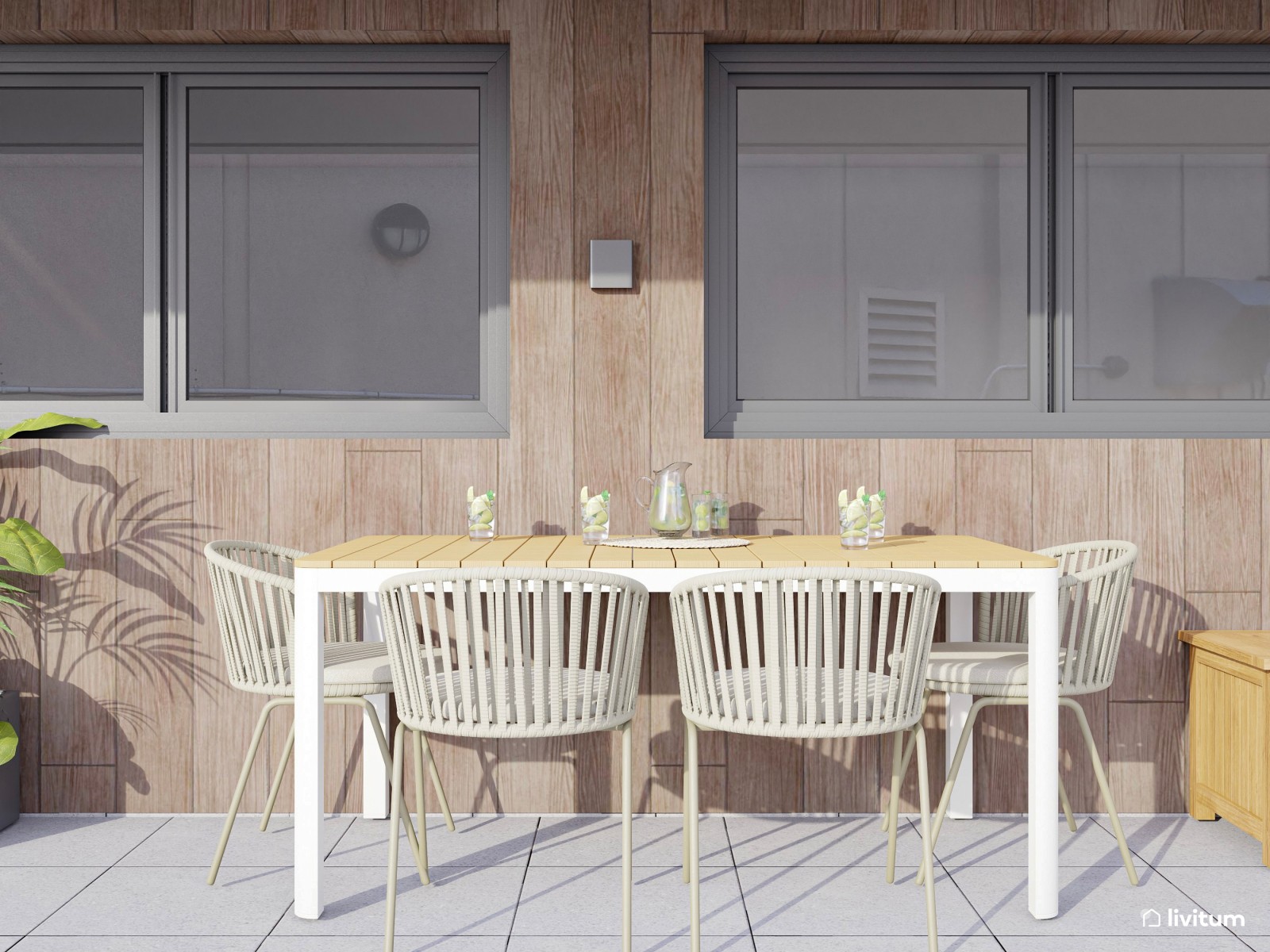Terraza con zona de salón y comedor exterior