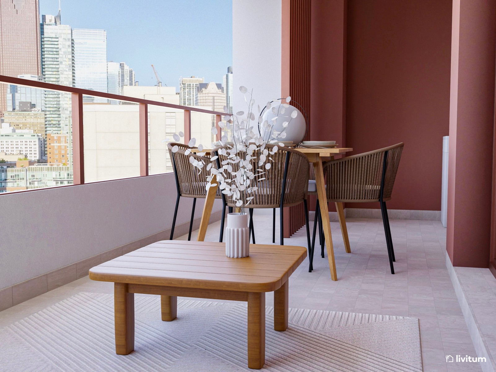 Terraza de color terracota, con comedor y zona de descanso