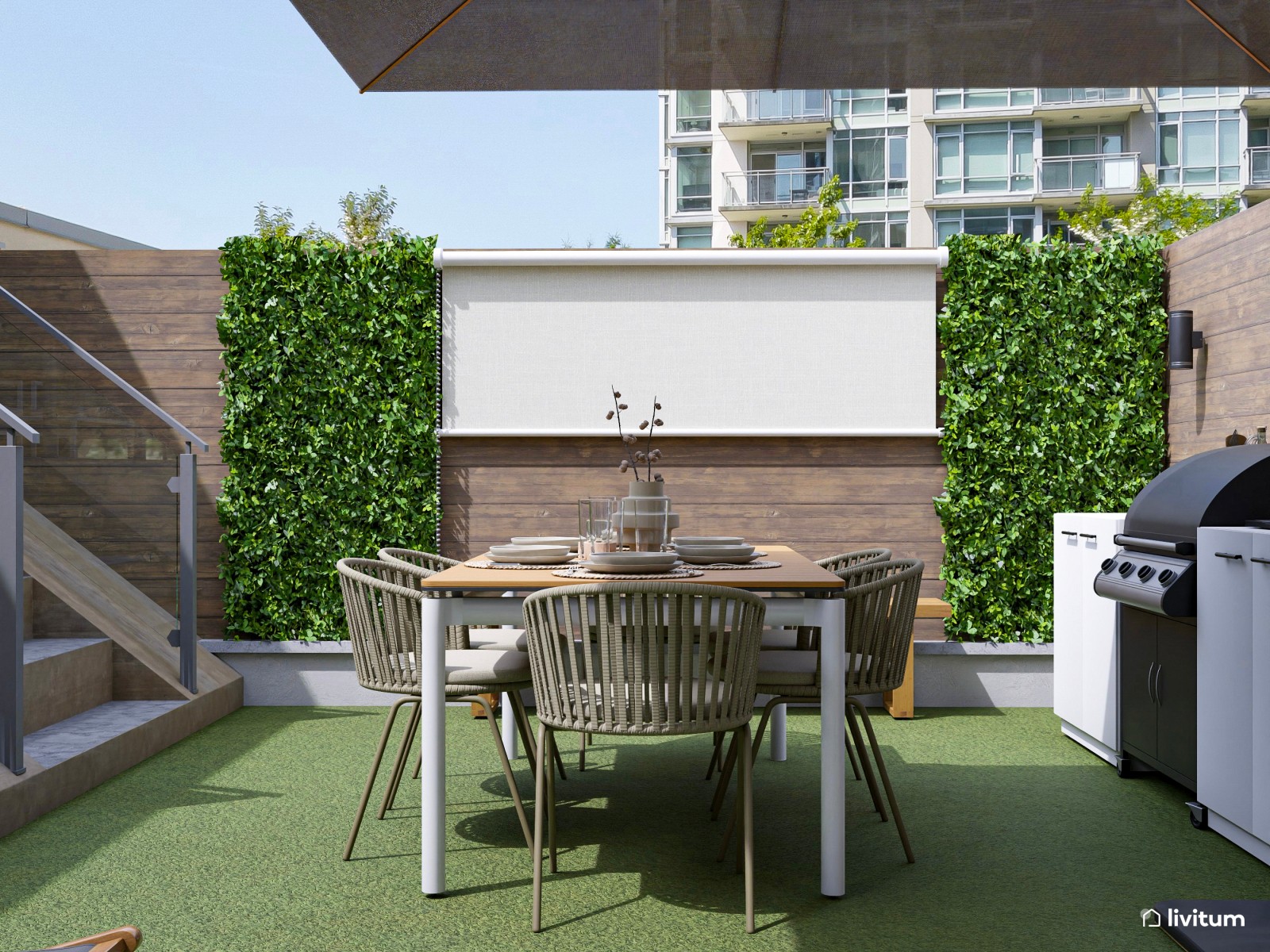 Terraza exterior con zona de barbacoa y dos zonas de descanso