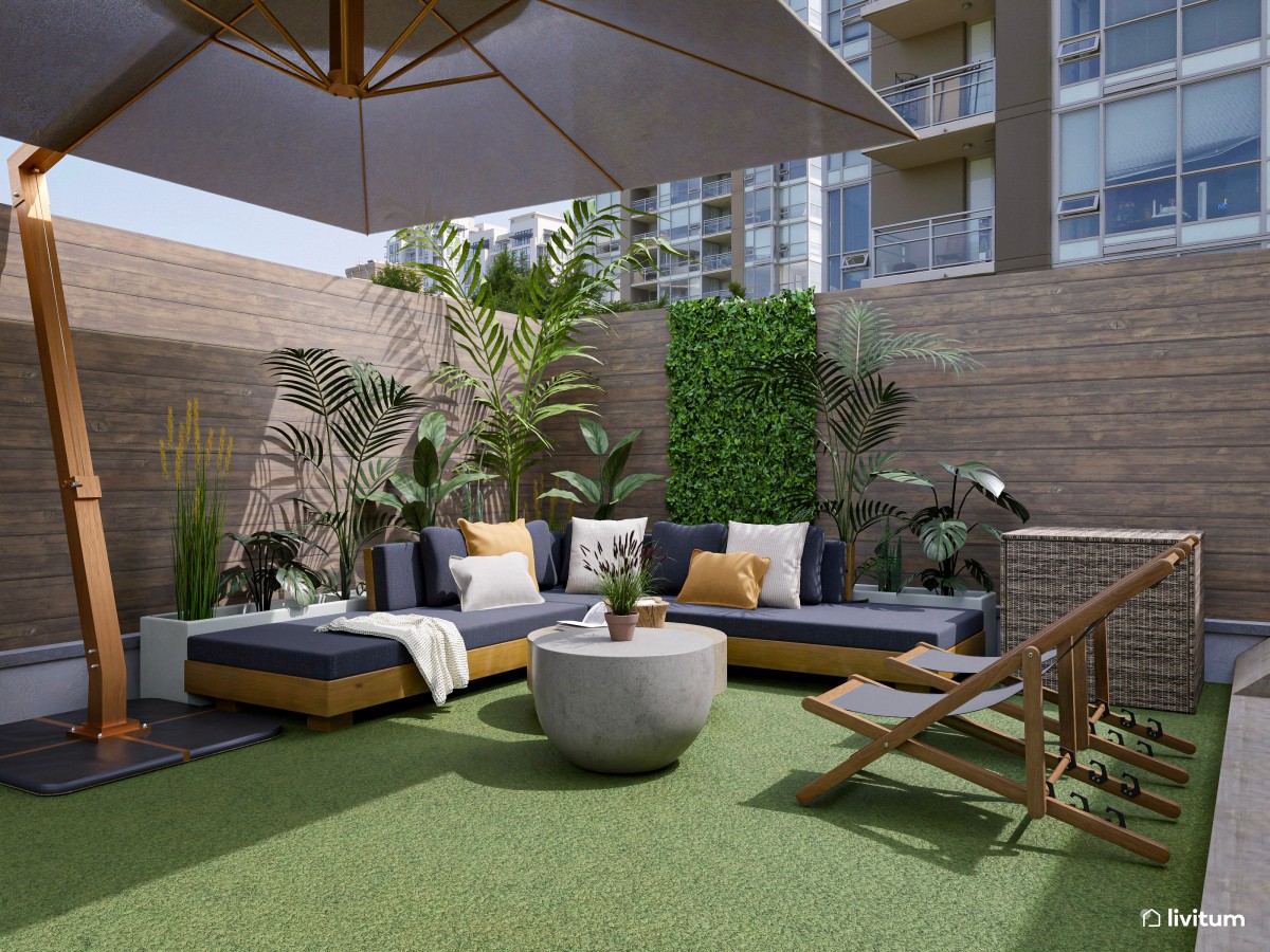 Terraza exterior con zona de barbacoa y dos zonas de descanso